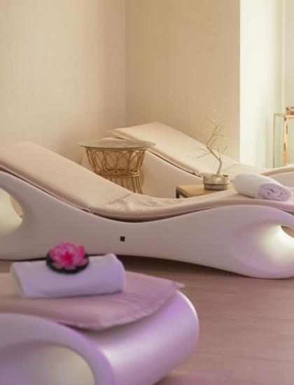 Modern loungers in a bright, relaxing spa setting.